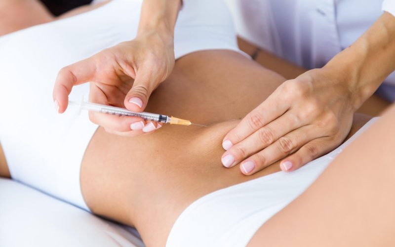 surgeon-making-injection-into-female-body-liposuction-concept(1) surgeon-making-injection-into-female-body-liposuction-concept(1)