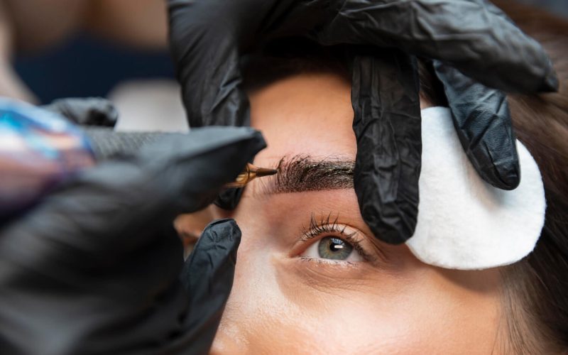 young-woman-getting-beauty-treatment-her-eyebrows(1) young-woman-getting-beauty-treatment-her-eyebrows(1)